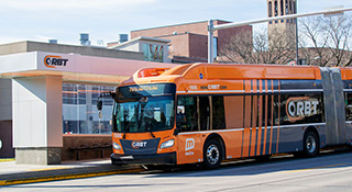 an orange orbit bus