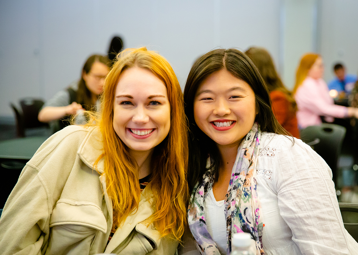 Two UNO English students smiling together